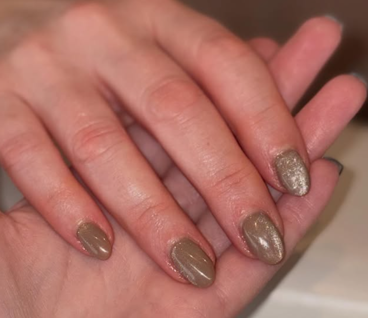 Glossy taupe nails with a subtle shimmer accent for an effortlessly chic look